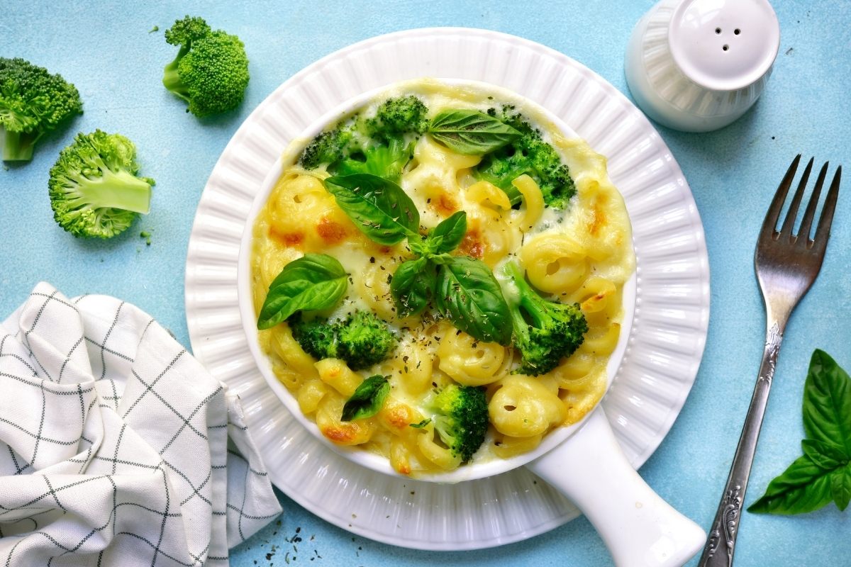 Broccoli mac and cheese served in a small ceramic pan.