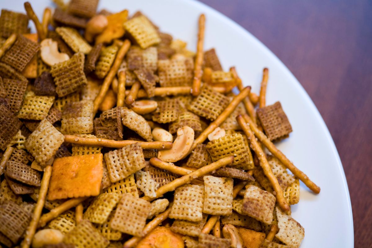 Traditional snack mix made with cereals, pretzels, crackers and nuts served at parties and holiday festivities.