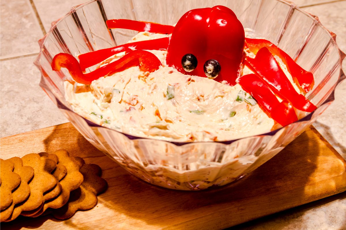 A bowl of salmon and cream cheese paté as dip for sweet red pepper.