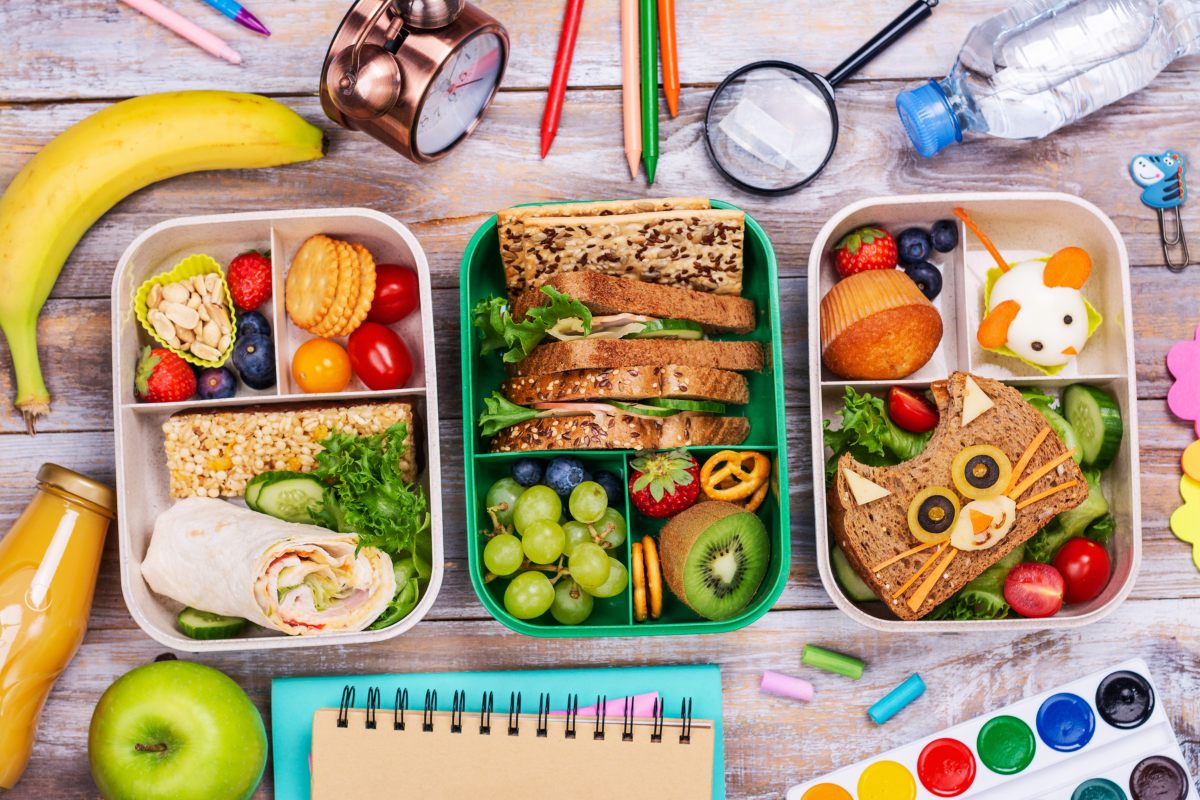Three kid lunch box ideas, one with a wrap, one with a traditional sandwich and a creative presentation for the third.