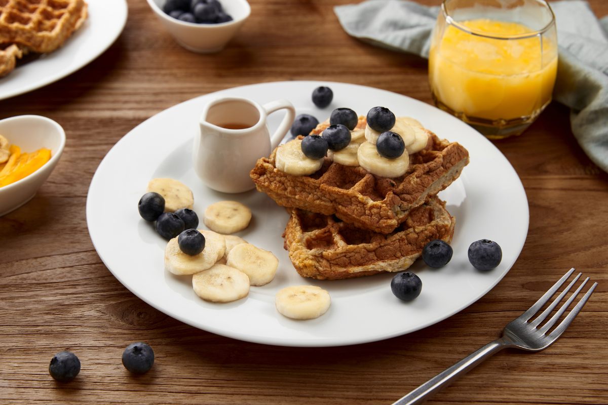 Breakfast oatmeal waffles with blueberries and banana.