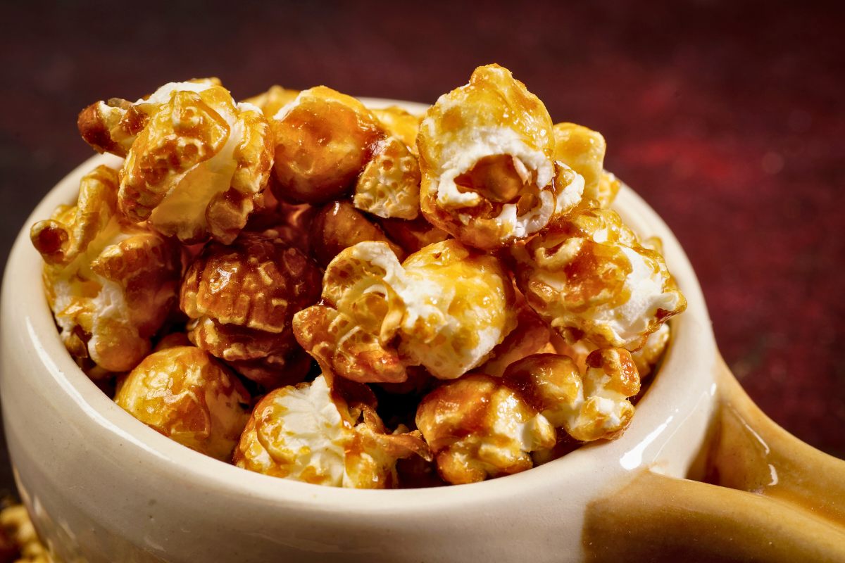 A small crockery pan with caramel corn.