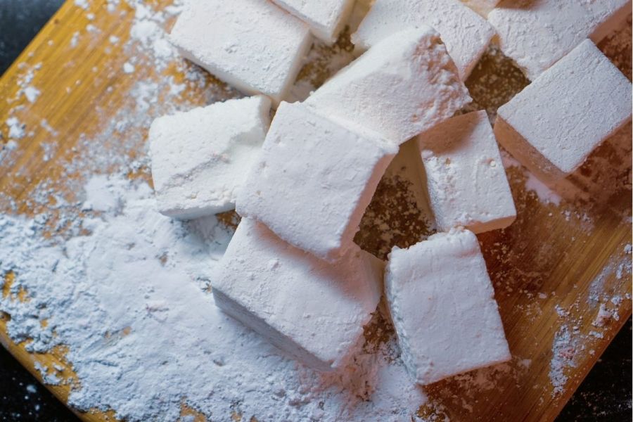 Homemade marshmallows on a board.