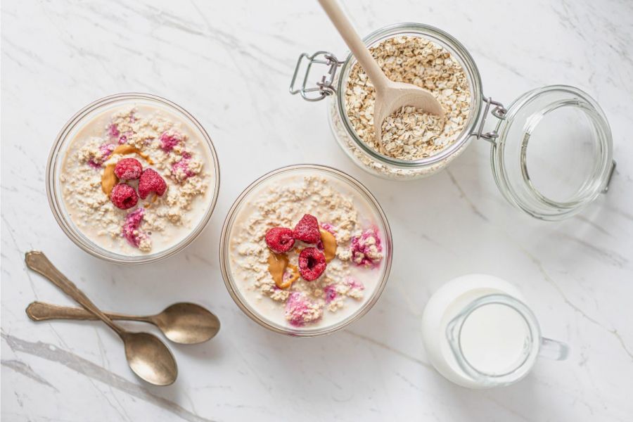 Two bowls of no-bake cinnamon roll overnight oats - a healthy and easy recipe with no baking required.