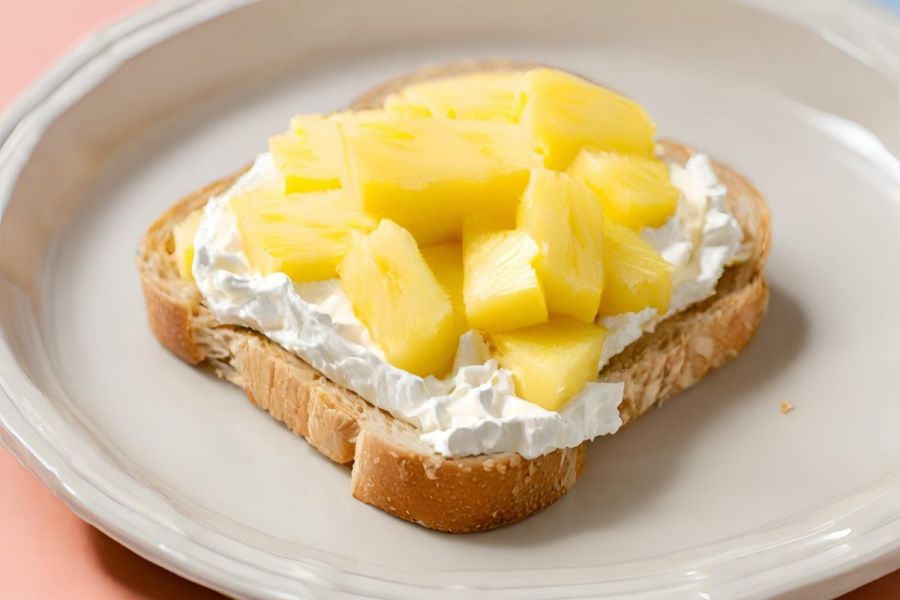 A pineapple and cream open sandwich.