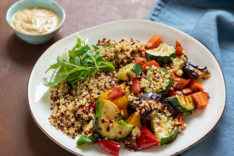 Quinoa and roasted Mediterranean vegetables salad on a plate.