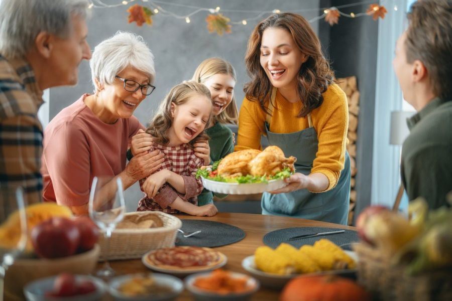 Thanksgiving happy family feast with three generations of the same family.