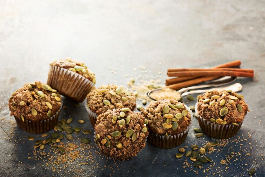 Muffins with a cinnamon sugar pumpkin seed topping.